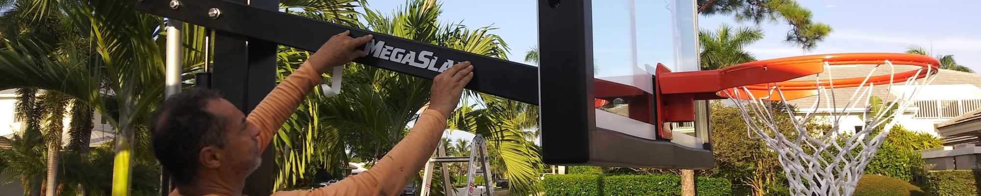 initial Banner installing basketball hoop arm sticker