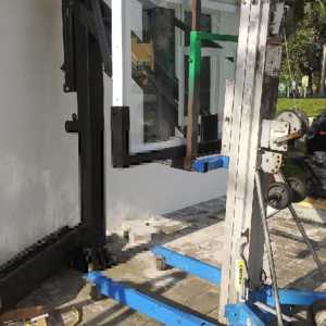 lifting the heavy backboard on a Mega Slam 60 in North Miami